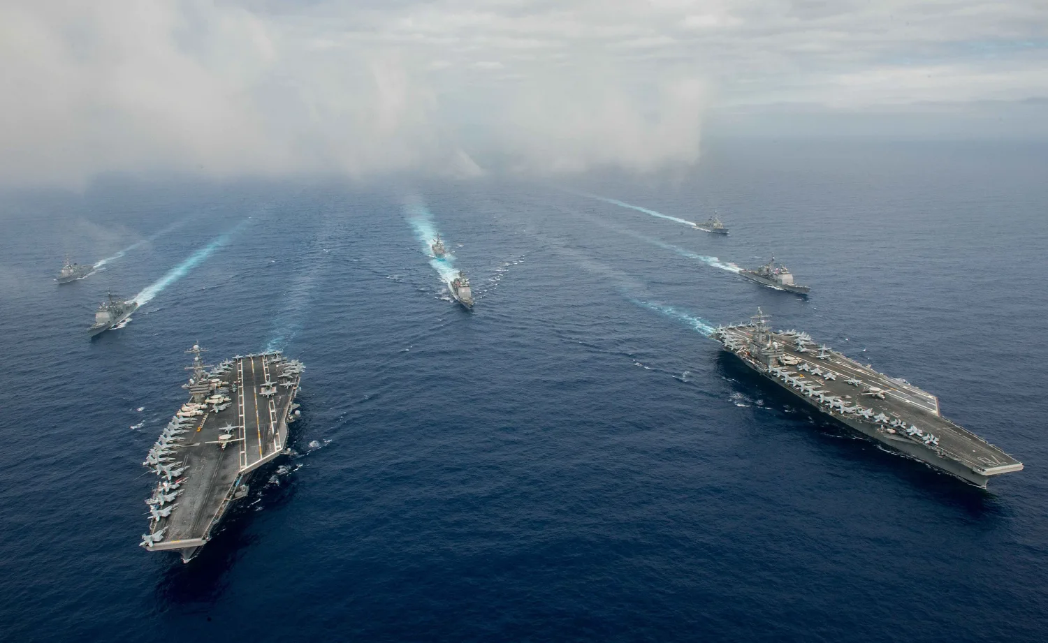 The Nimitz class aircraft carriers USS John C. Stennis (CVN 74), left, and USS Ronald Reagan (CVN 76) conduct dual aircraft carrier strike group operations (27142323334)